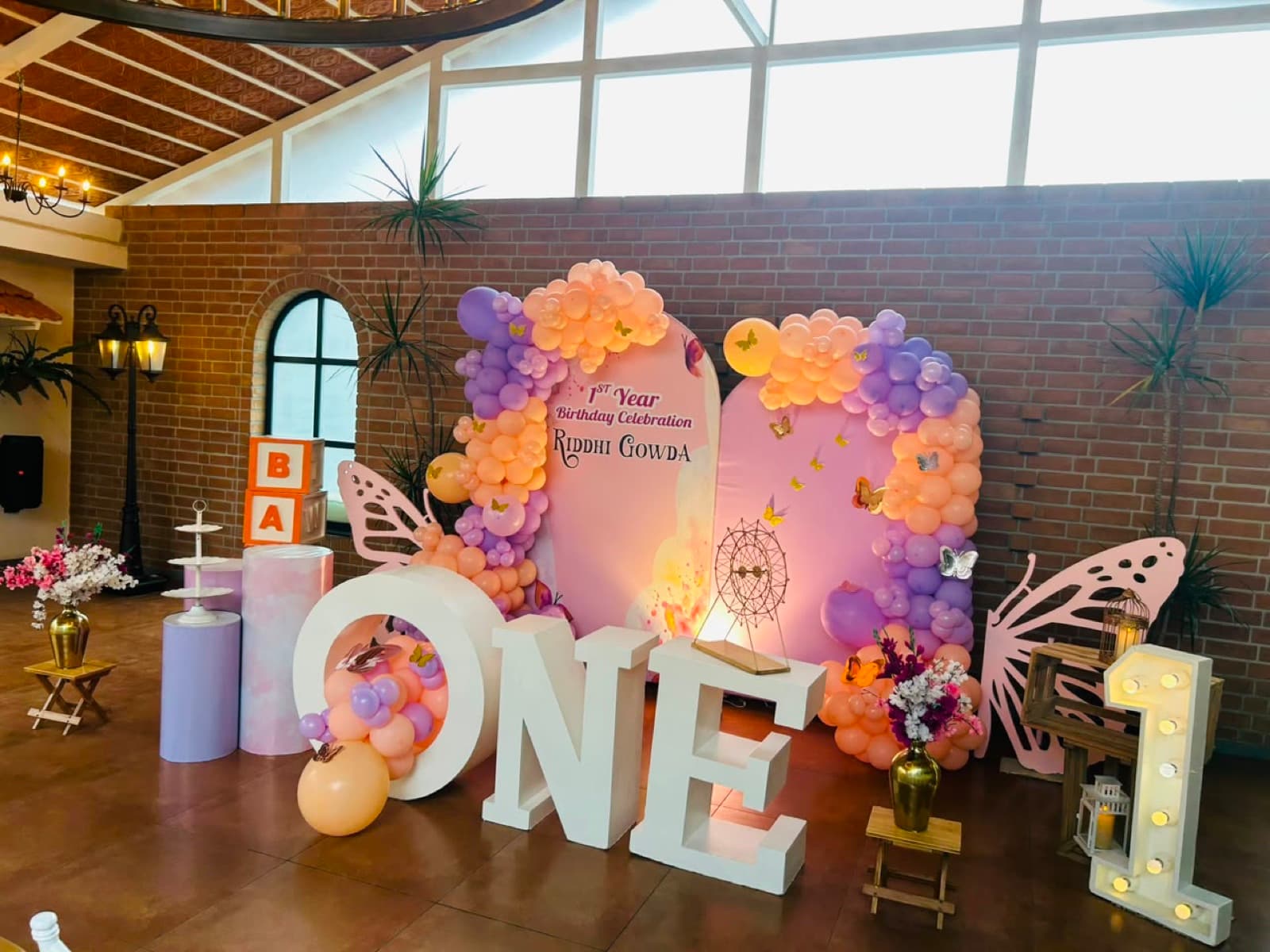 First birthday setup with butterfly backdrop