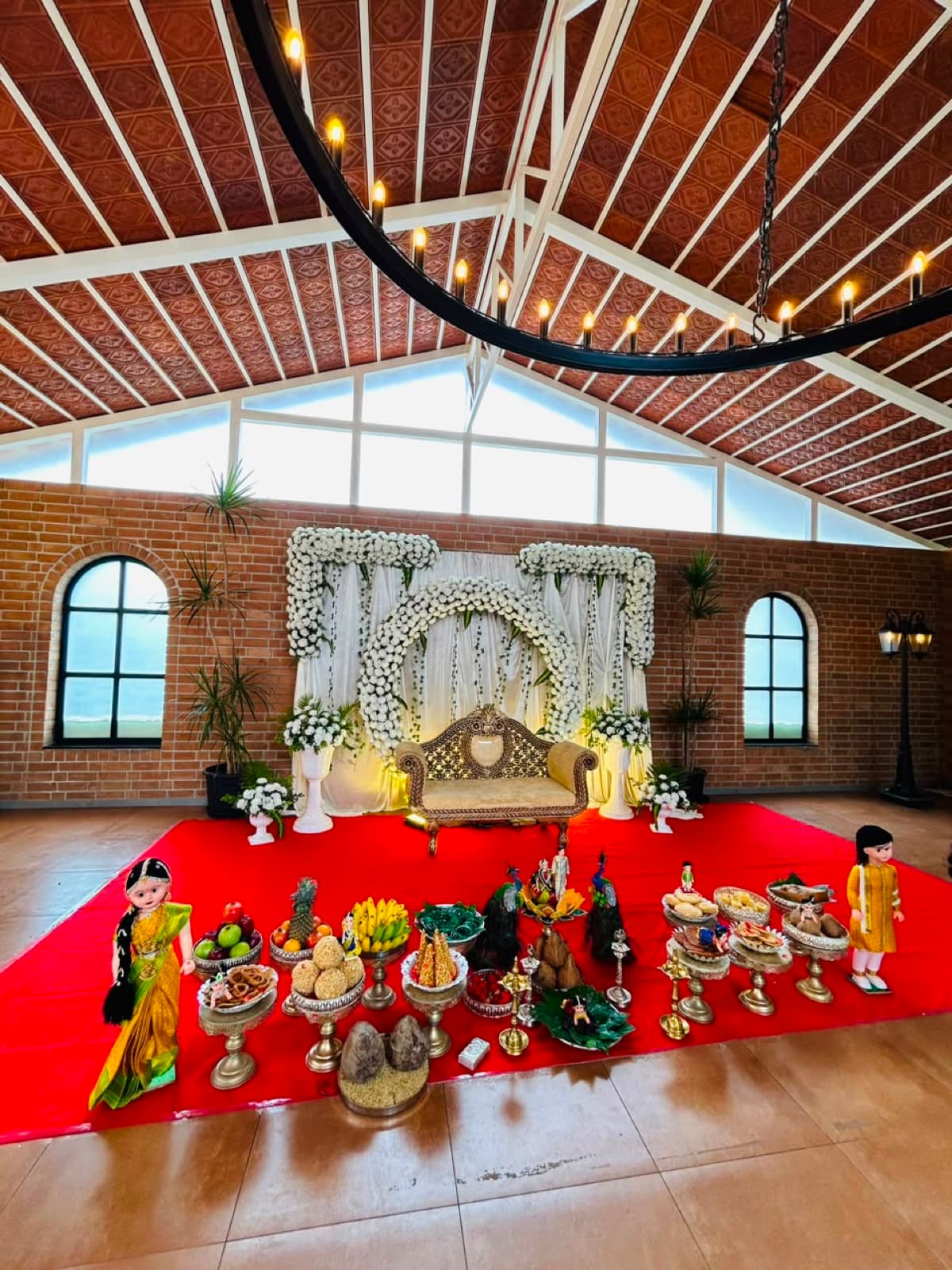 The hall under its timber ceiling and ring chandelier